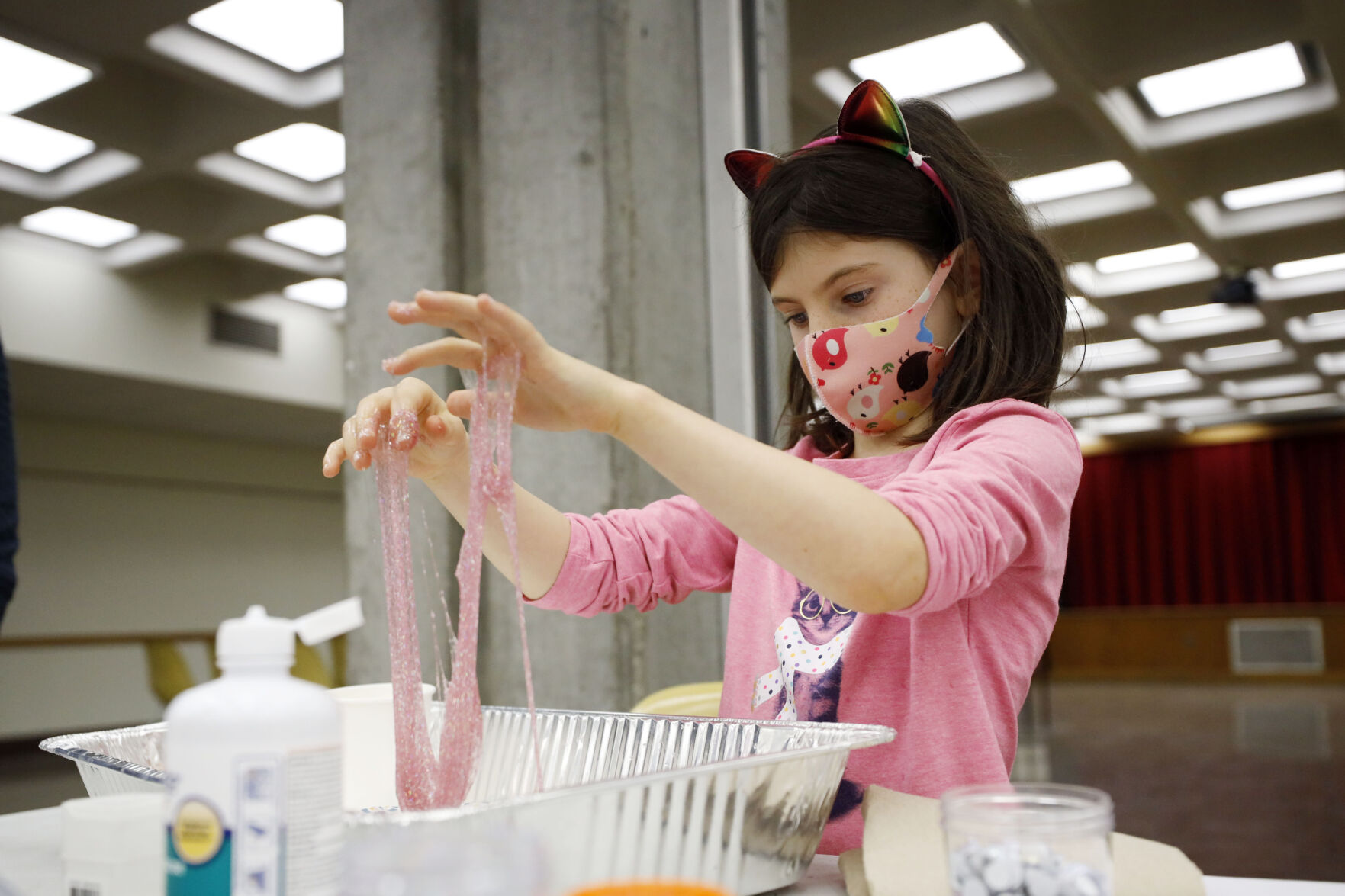 girl making pink slime